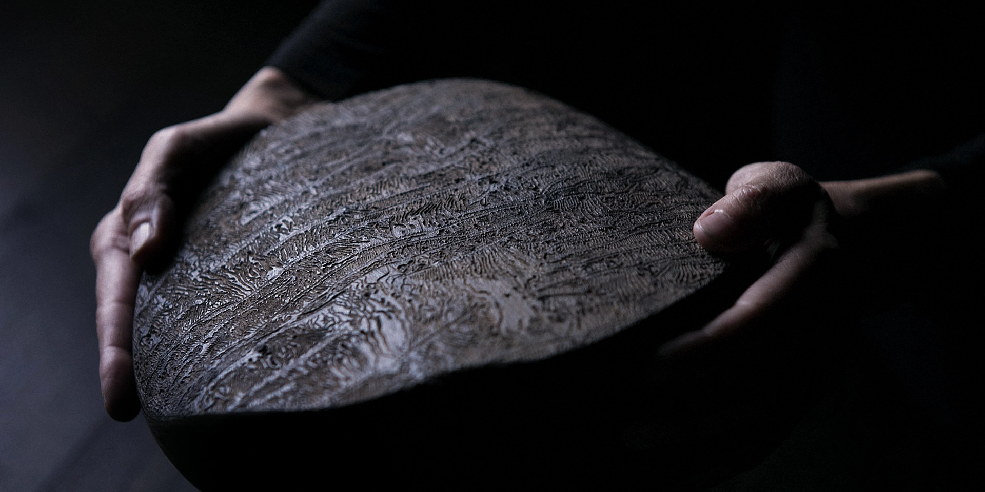 Natural artisanal handcrafted platter with traces of worms